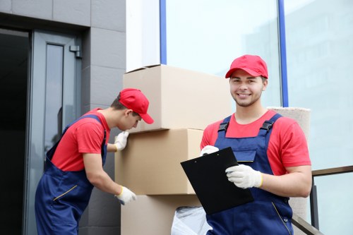 Local removals team working in Swiss Cottage with packed boxes and furniture