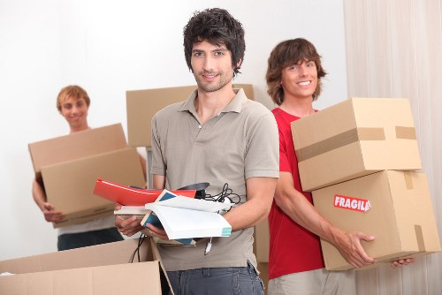 Loading household furniture into a removal truck for a flat move