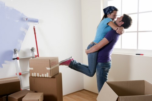 Commercial moving vehicle loading office equipment for Swiss Cottage businesses