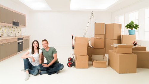 Furniture and boxes being prepared for a removal van in Swiss Cottage