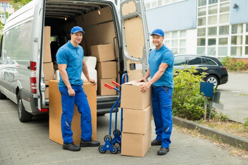 Preparing an office move with labelled boxes and workstation organisation
